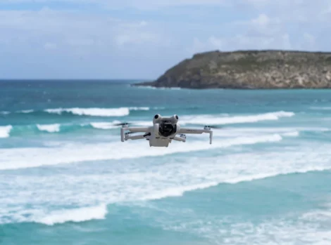 What is a UAV pilot explained with image capturing aerial footage over water using a professional drone