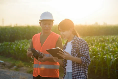 What is a UAV pilot portrayed through a agriculture drone pilot reviewing drone data during a field inspection