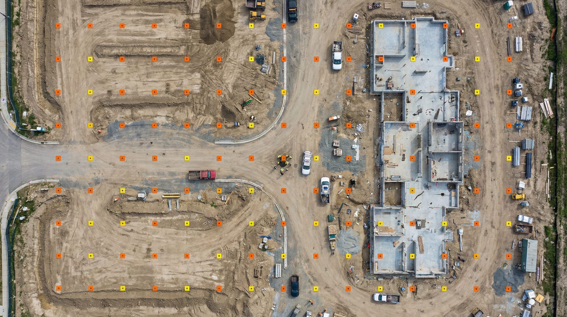 Aerial view of a construction site showing ground control points used for drone survey accuracy